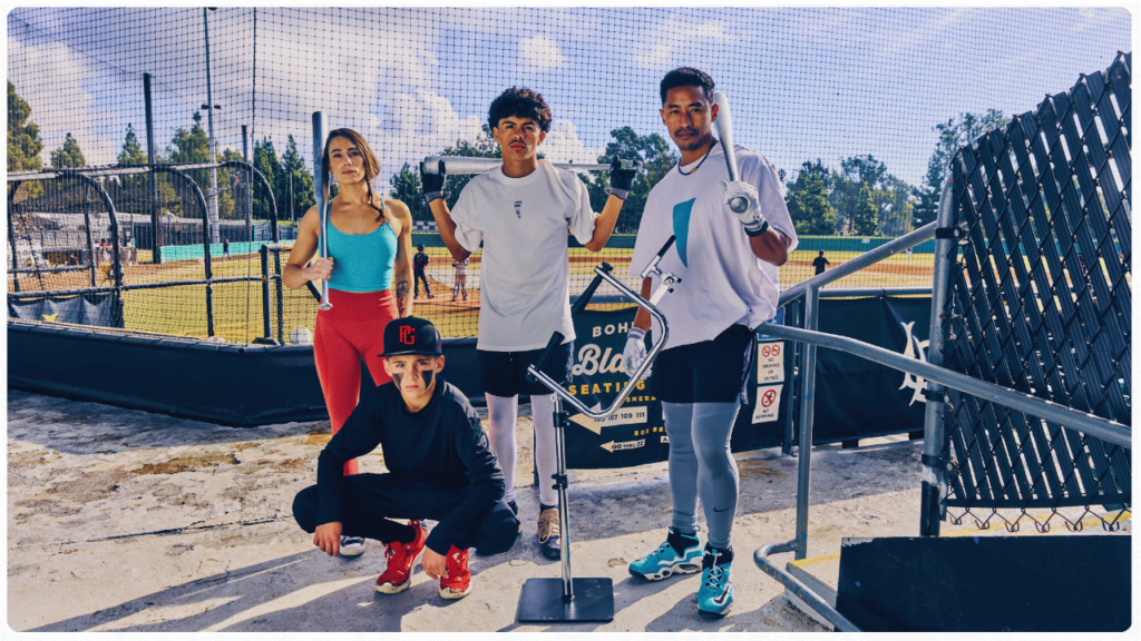 Young baseball players practicing with the Attack Tee, the best baseball tee for 8-year-old players, designed for adjustable height, unlimited bat path angles, and swing training.